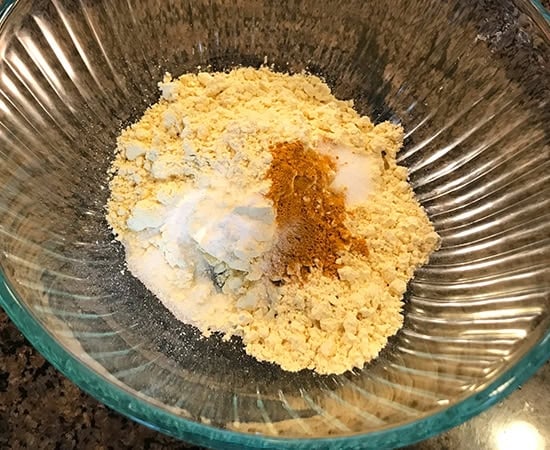 besan with dry spices in a glass bowl
