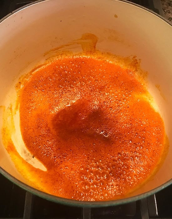 bright red color spices in a pot