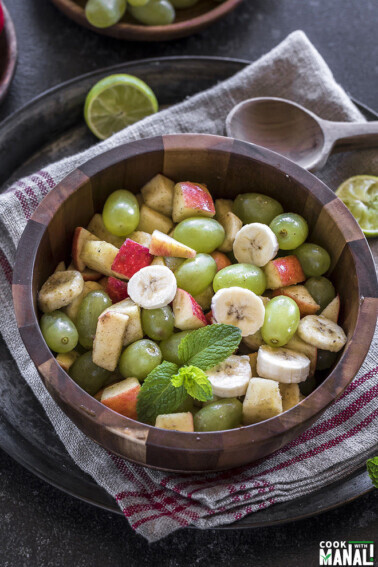 Indian fruit chaat in a wooden bowl