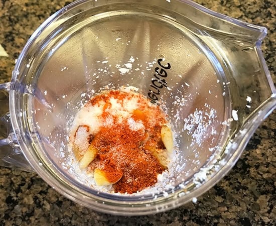 grated coconut, chili powder in a blender