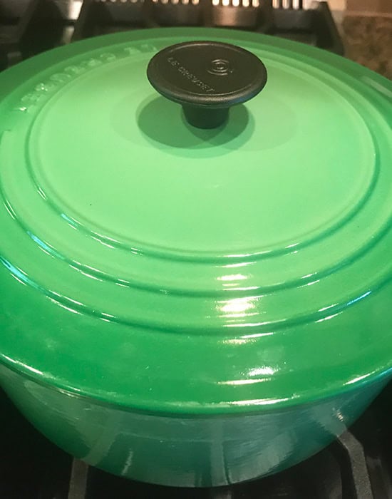 green color lid over a dutch oven