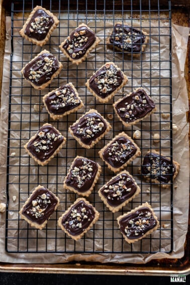 hazelnut shortbread cookies arranged on a wire cooling rack