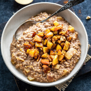 oatmeal topped with caramelized apples served in a bowl
