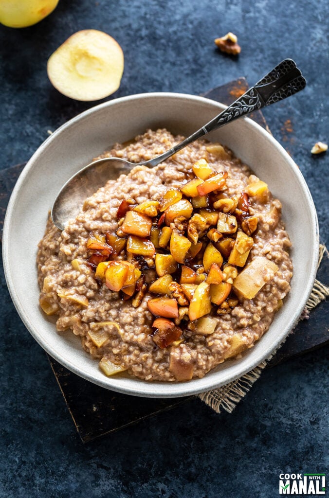 oatmeal topped with caramelized apples served in a bowl