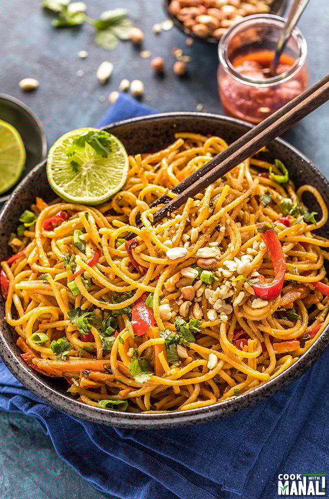 instant pot thai peanut noodles served in a black bowl with chopsticks on the side