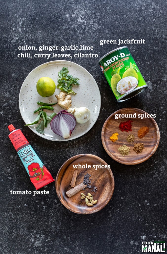 ingredients for making masala jackfruit arranged on a board