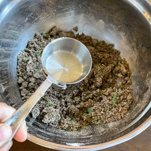 water being added to a flour mix