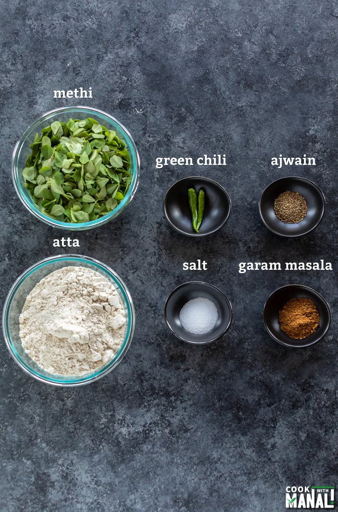 6 bowls filled with different ingredients like spices, flour, salt