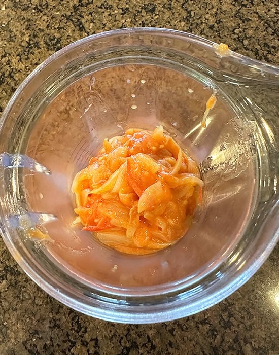 cooked onions and tomatoes in a blender