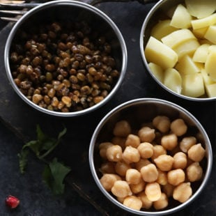 3 small bowls containing boiled dal, chickpeas and potato each