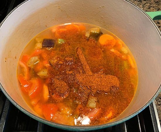 veggies with water and spices in a pot