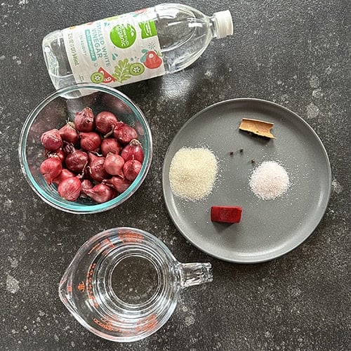 ingredients for Indian pickled onions arranged on board