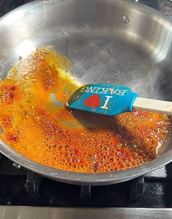 spices getting cooked in a pan