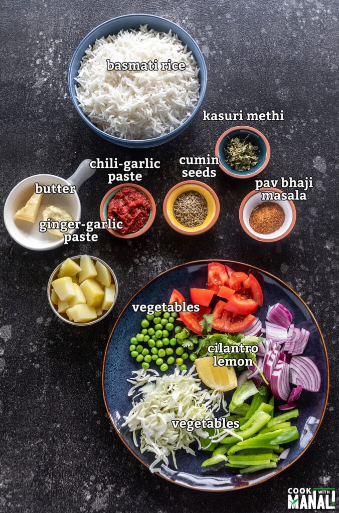 ingredients for making tawa pulao arranged on a board