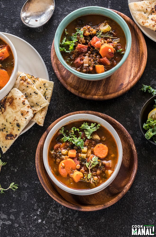 overhead shot of 3 bowls of vegan lentil soup