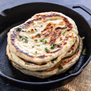 stack of naan on a iron skillet